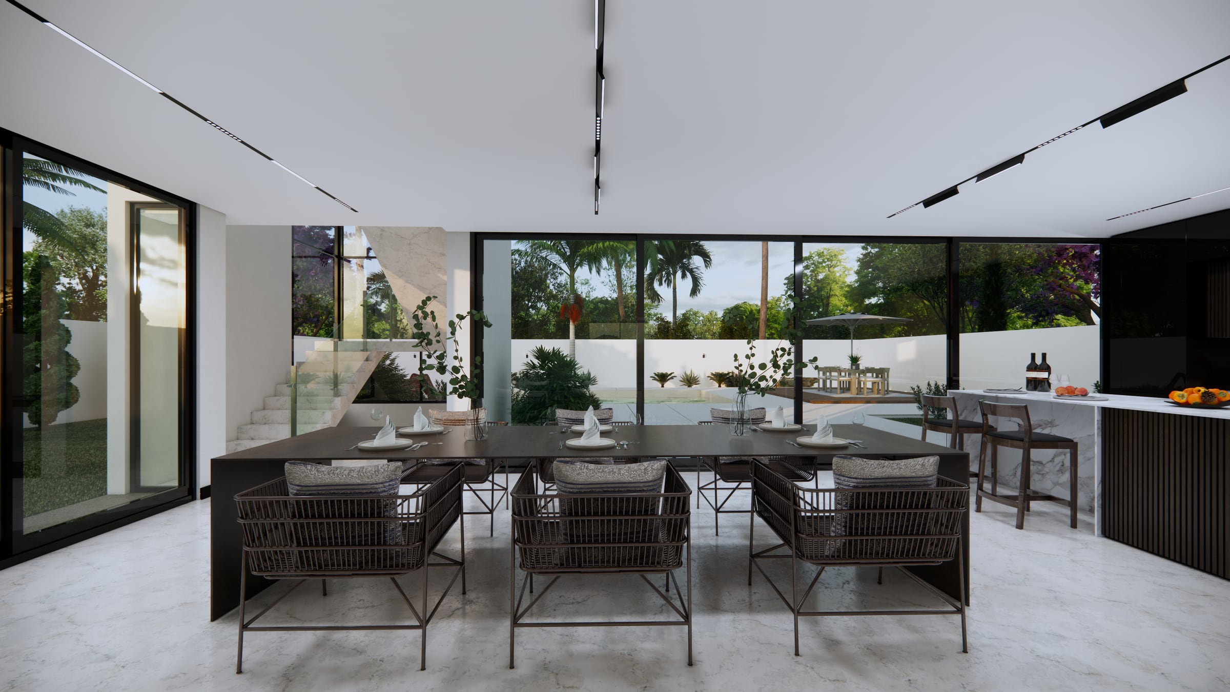 Eetkamer met lange tafel die over de volle breedte opengaat naar de tuin en het zwembad